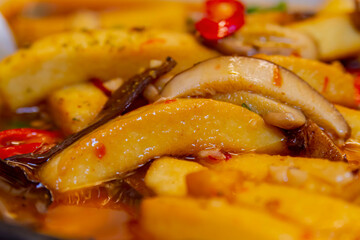 Close up shot of fried tofu with mushroom
