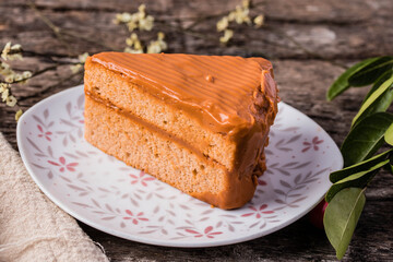 Triangle Thai tea cake on wooden background