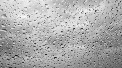 Water drops on a glass on a rainy day