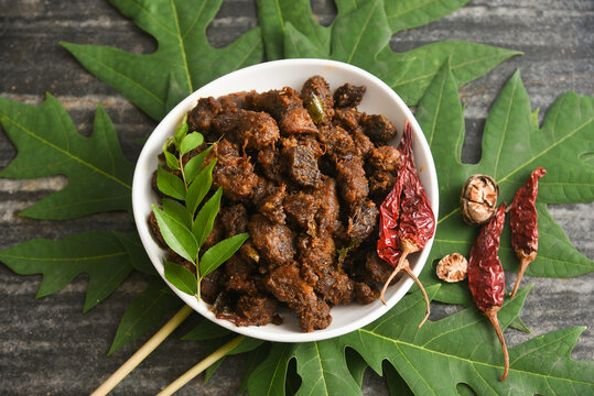 Kerala style beef or Mutton dry fry. delicious spicy Beef fry . beef curry for ghee rice, kappa, appam, parotta, puttu, bread and chappathi, beef roast. Indian cuisine .