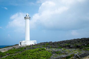 Fototapeta na wymiar Cape Zanpa Lighthouse, Okinawa, Japan with blue sky and surrounding scenery