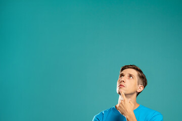 Doubtful man. Make decision. Information banner. Create plans. Puzzled guy looking up holding chin...