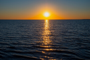 Beautiful sunset on the sea with golden sky, great design for any purposes. Summer nature landscape. Travel concept background. Sea landscape.
