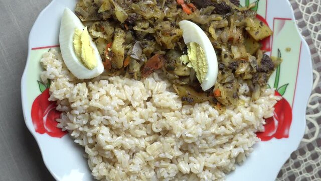 Close up of Arrimado de Col cooking and smooking, homemade typical Peruvian food