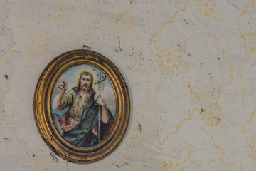 round holy picture on the wall with wallpaper