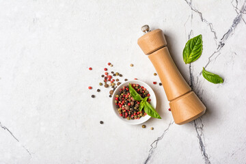 Bright spices, basil leaves with pepper mill for tasty cooking © viktoriya89