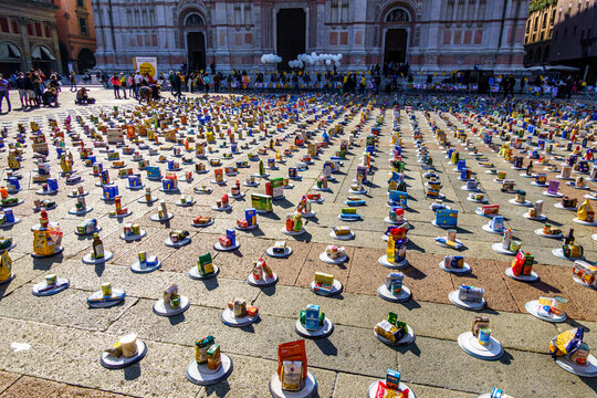 Bologna, Italy - October 10, 2020: Participants in the action "riempi il piatto vuoto" (translation: "fill the empty plate") by Caritas and CEFA while collecting food for the needy on Piazza Maggiore 