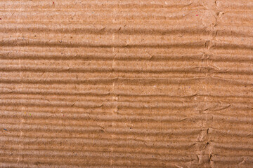 Corrugated brown cardboard sheet of paper texture or background flat lay, Folded recycle carton paper box