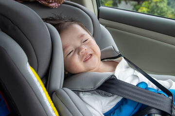 Local lifestyle Asian Chinese baby boy happy smiling white sit on child safety car seat