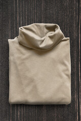 Pullover on wooden background