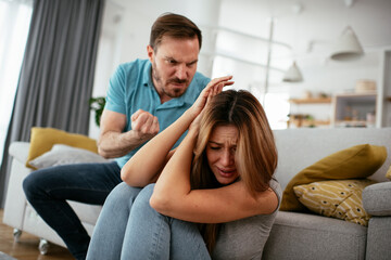 Violence in family. Husband beating his wife.