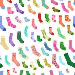 Fototapeta na wymiar Seamless pattern with doodle socks of different texture and color. Winter trendy clothing items background