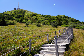 wooden staircase for access to mountain pariou in Puy de Dôme volcano in Auvergne france