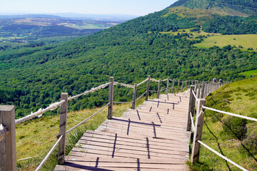 Stairs wooden pathway of the Puy de Dome volcano mountain in auvergne center france