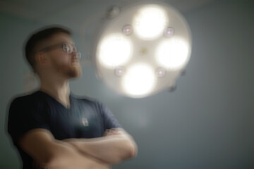 surgeon blurred background / concept medicine, background surgery, work clothes, blur modern...