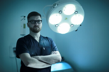 male doctor / young man in median uniform, strict doctor with glasses, medical clinic