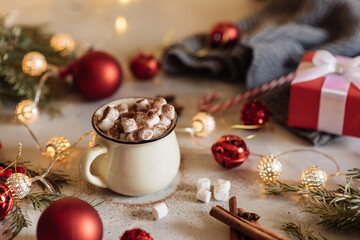 Mug for mockup near christmas tree and gift boxes