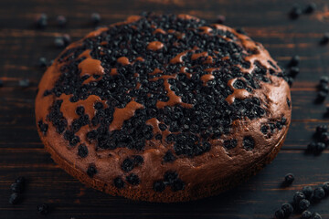 Blueberry pie with berries, homemade fresh pastries, on a wooden background. Copy space.