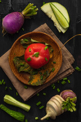 Delicious and healthy food lie on a wooden black background
