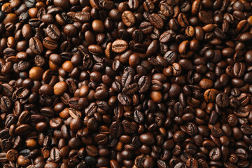 Roasted coffee beans on whole background, close up