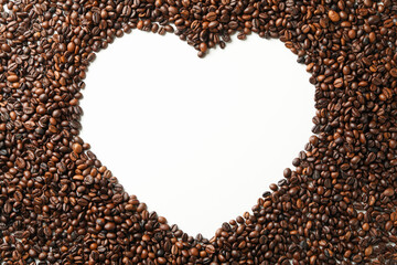 Naklejka premium Heart made of coffee beans on white background