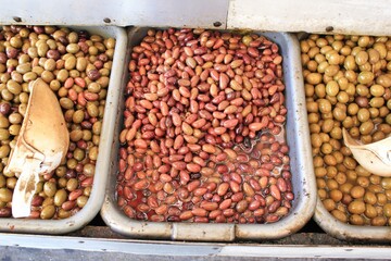 Stall with Kalamata or Kalamon olives at street market in Athens, Greece.