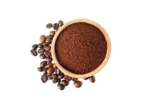 Wooden bowl with ground coffee isolated on white background