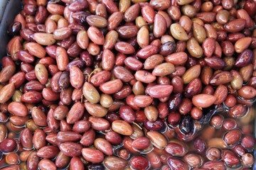 Stall with Kalamata or Kalamon olives at street market in Athens, Greece.