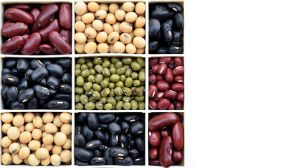 close up of different beans in box isolated on white background