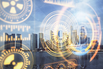 Double exposure of technology theme hologram and cityscape background. Concept of Hightech.