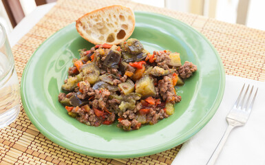 dish of vegetable stew. stewed eggplant, minced meat, carrots, peppers, onion squid