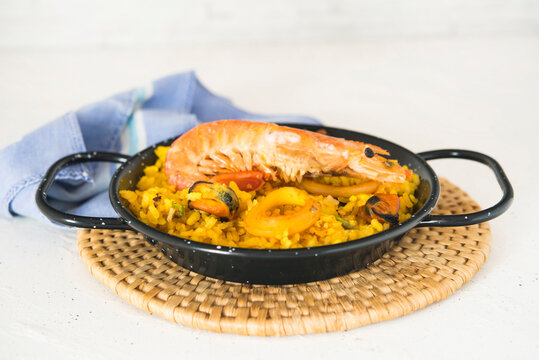 Paella typical spanish food in granite background