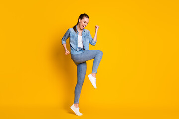 Fototapeta na wymiar Full size photo of delighted girl celebrate lottery lucky win raise fists scream yeah wear good look clothes gumshoes isolated over bright color background