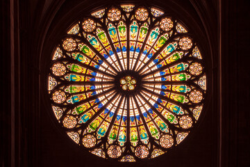 Rosette, huge beautiful stained glass window by the interior of notre dame cathedral in Strasbourg.