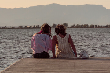 Young couple kissing in front beautiful lake landscape
