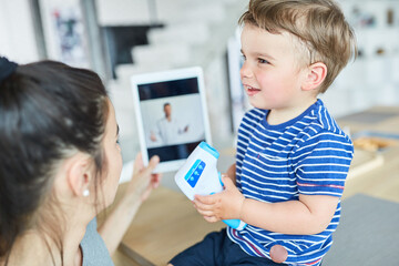 Doctor in an online consultation with a child