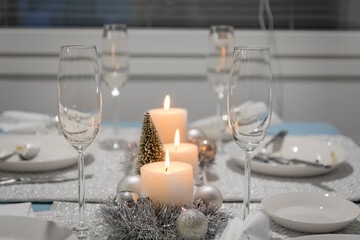 Beautiful table for Christmas. Serving. Christmas candles.