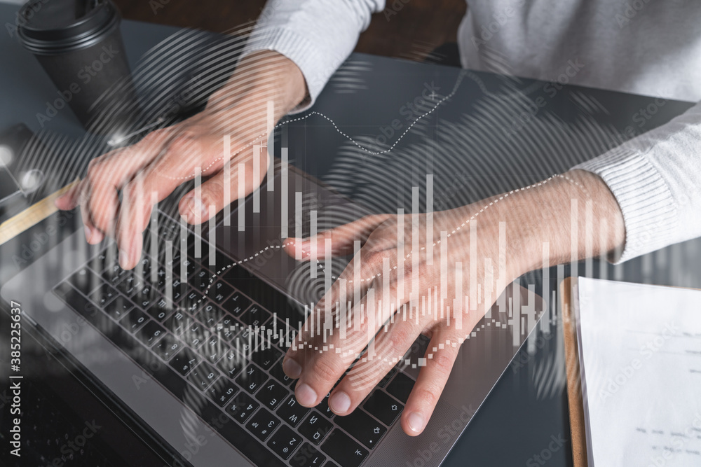 Poster man using computer. hands typing laptop. double exposure with forex graph hologram. close up. stock 