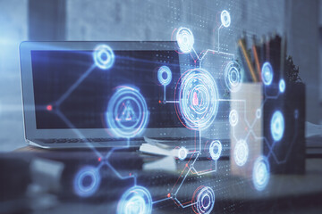 Double exposure of laptop computer and technology theme hologram. Concept of freelance work.