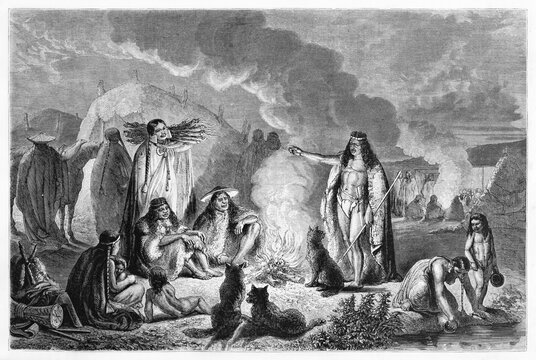 Teuelche people tribe around fire in their camp at evening, Patagonia. Ancient grey tone etching style art by Hadamard, published on Le Tour du Monde, Paris, 1861