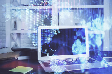 Forex market chart hologram and personal computer background. Double exposure. Concept of investment.