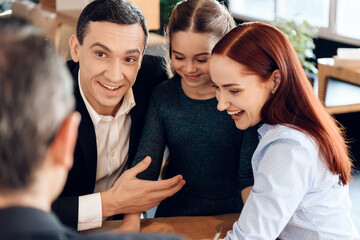 Young happy family received cash compensation.