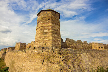 Fototapeta na wymiar Tower and walls of Akkerman fortress (also known as Bilhorod-Dnistrovskyi fortress) in the city of Belgorod-Dniester, Ukraine. The ruins of an ancient fortress. Ukrainian landmark