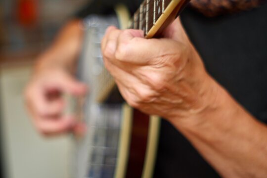 Person Playing The Banjo