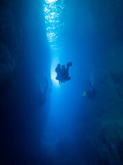 Divers in the canyon at the Inland Sea on the island of Gozo, Malta
