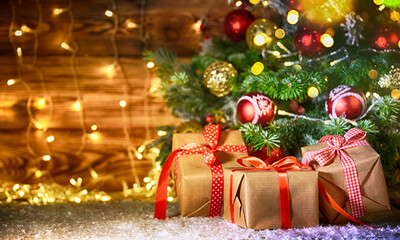 Fototapeta na wymiar Christmas treewith gifts, rustic background