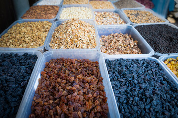 Dried berries on the counter. Raisins, dried prunes. Vegan food. healthy food. Selective focus.