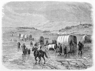 migrants caravan walking on a muddy flat ground in North America. Ancient grey tone etching style art by Lavieille and Pannemaker, Le Tour du Monde, Paris, 1861