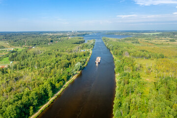 Top view of a water channel and a moving barge