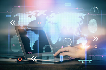 Multi exposure of world map hologram with man working on computer on background. Concept of worldwideweb.